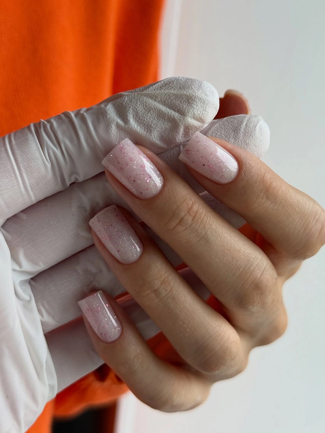 chic nude fall nails 2026 Sheer Pink Glitter For A Soft Fall Glow