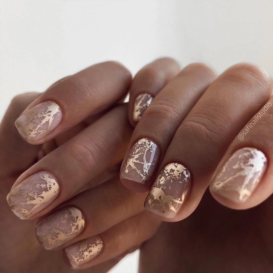 chic nude fall nails 2026 Sheer Nude With Delicate Gold Foil