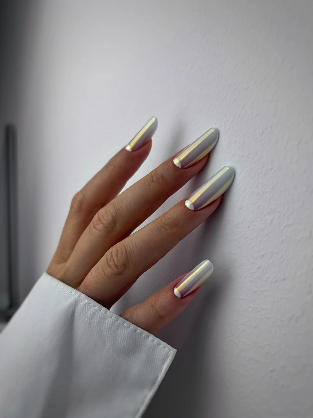 chic october nails design 2026 Opalescent Chrome Nails With a Futuristic Glow