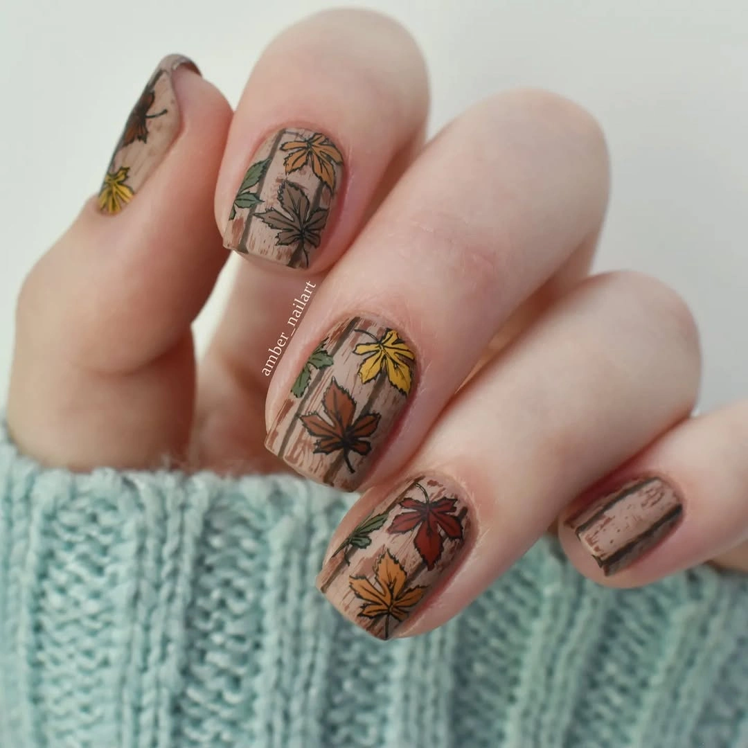 creative fall manicure ideas 2026 Autumn Leaves On A Cozy Neutral Base