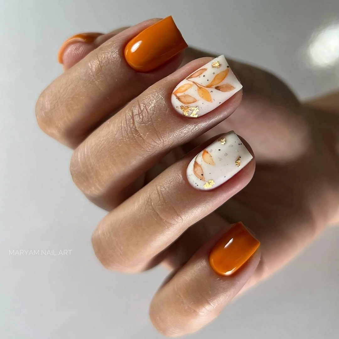 creative fall manicure ideas 2026 Soft Botanical Art In Warm Pumpkin Tones