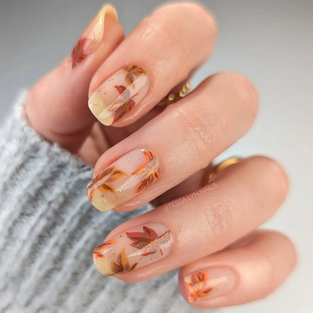 creative fall manicure ideas 2026 Soft Maple Leaves With Delicate Gold Details