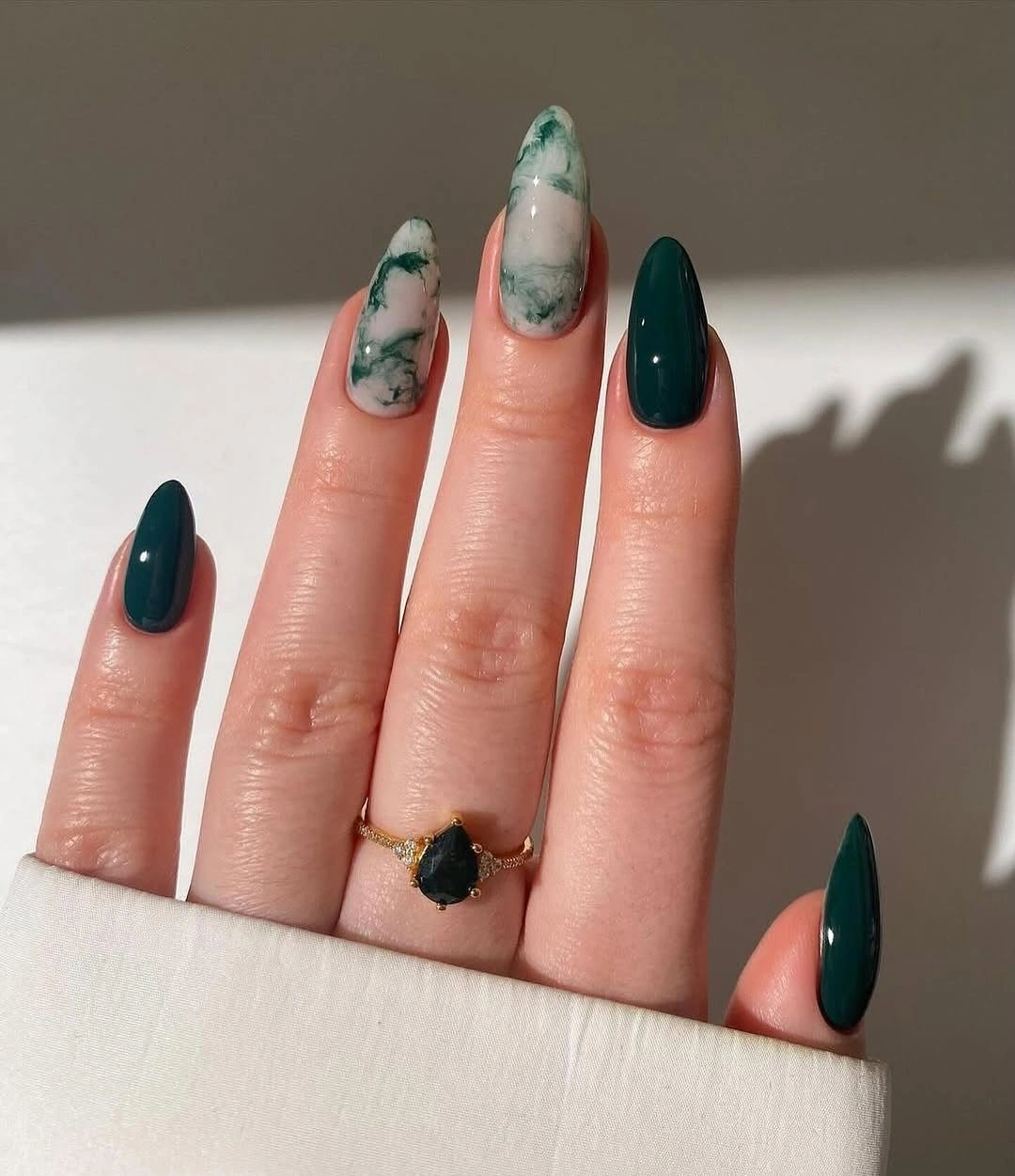 creative fall nail inspiration 2026 Emerald Marble Almond Nails With a Luxe Stone Effect