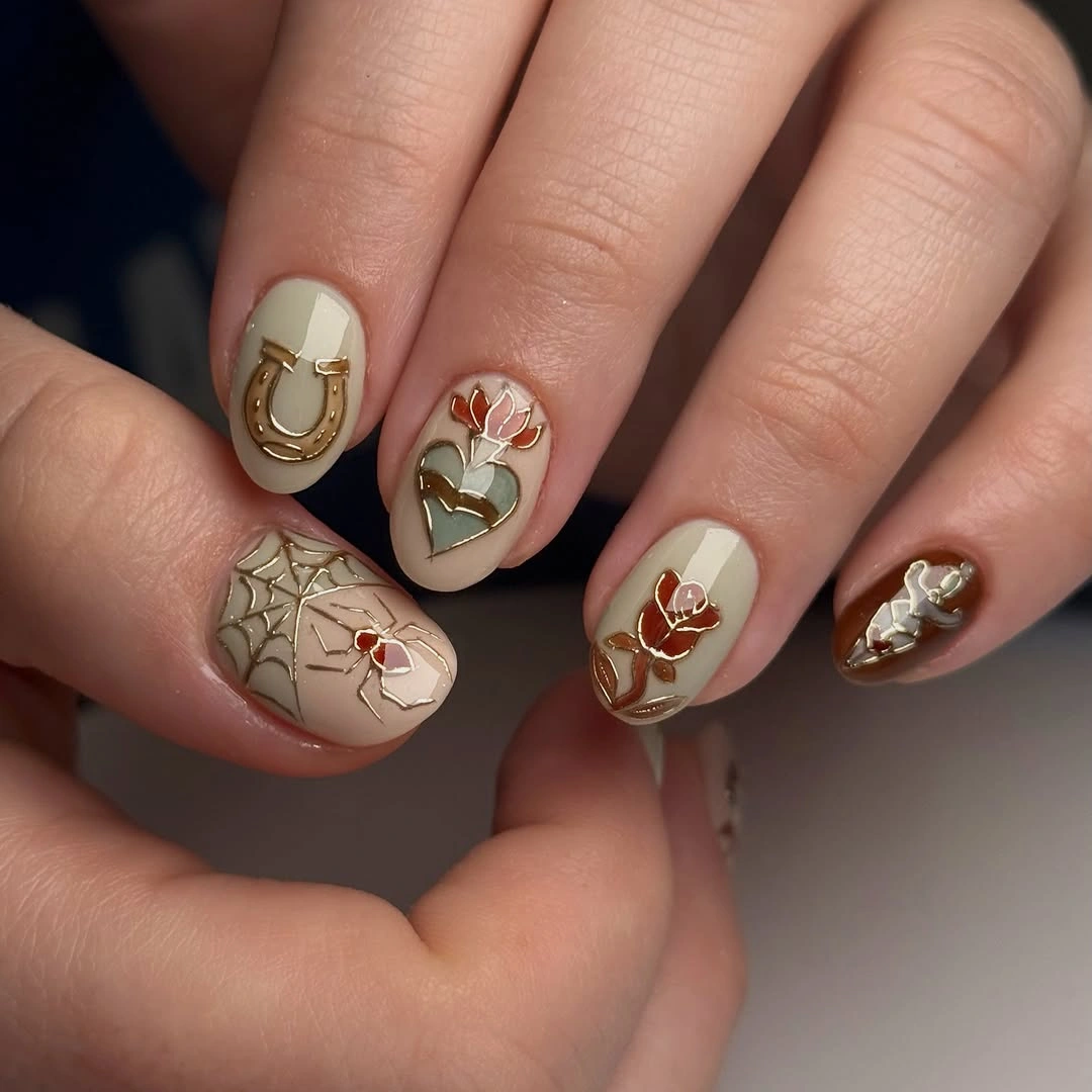 creative fall nails with accent nail Soft Neutral Nails With Gold Botanical Details