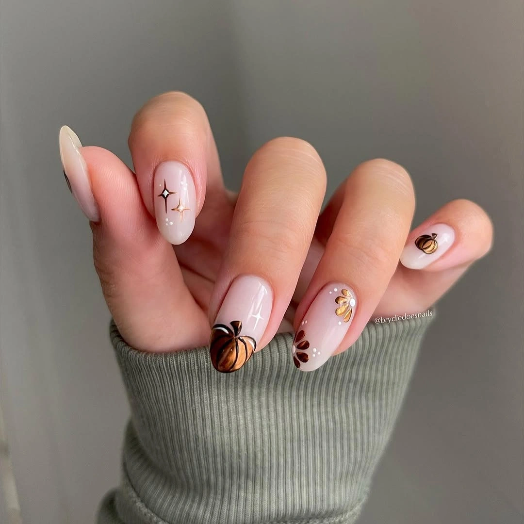 creative fall nails with pumpkins 2026 Minimal Bronze Pumpkin Nails