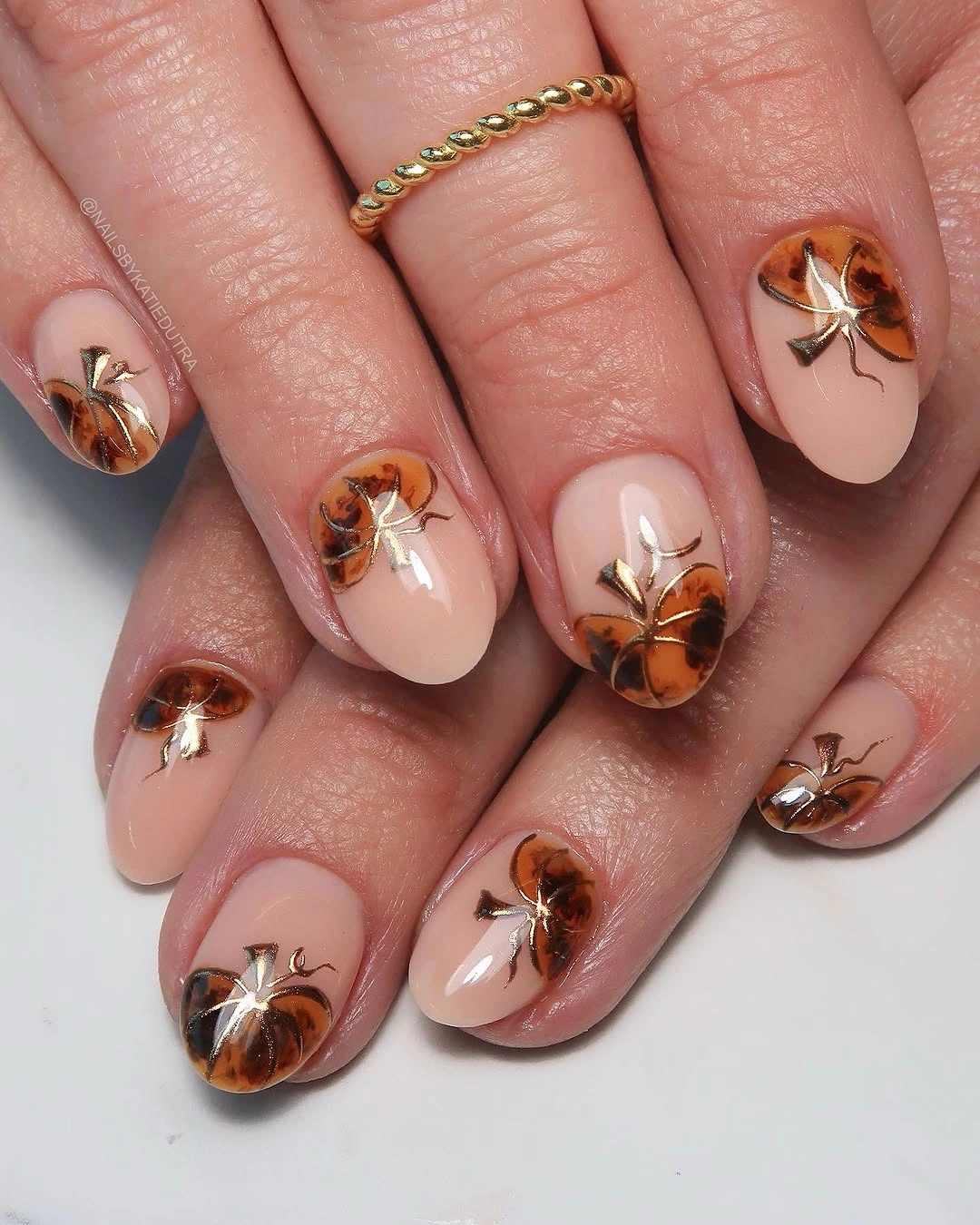 creative fall nails with pumpkins 2026 Amber Glass Pumpkin Nails