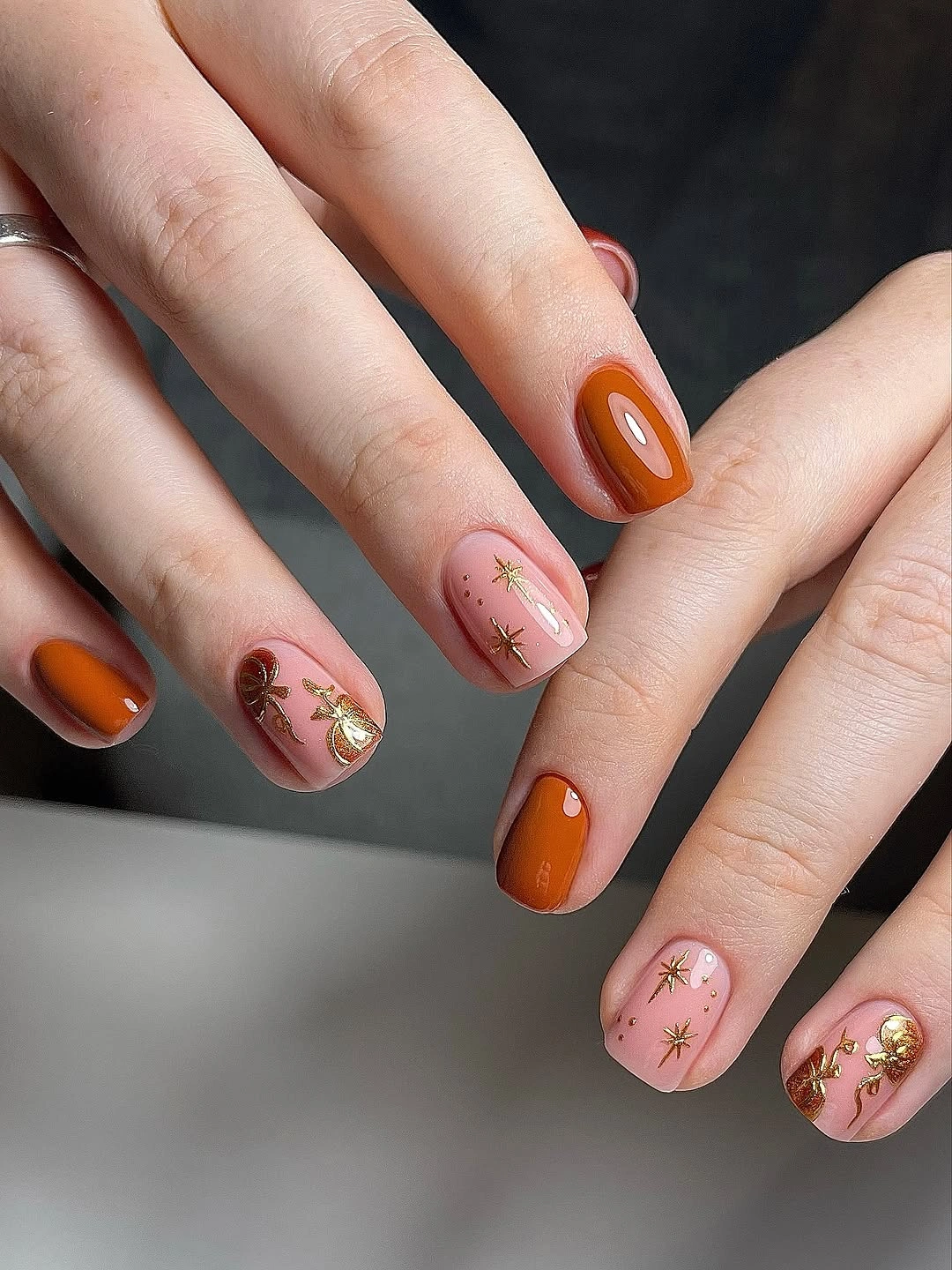 creative fall nails with pumpkins 2026 Minimal Pumpkin and Gold Star Nails