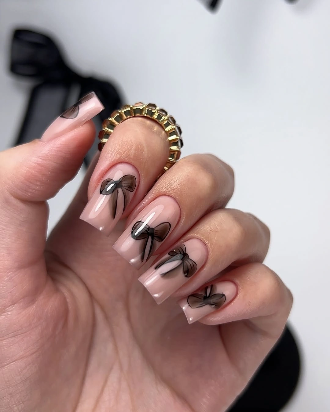 cute early fall nails 2026 Sheer Pink Nails With Delicate Black Bows