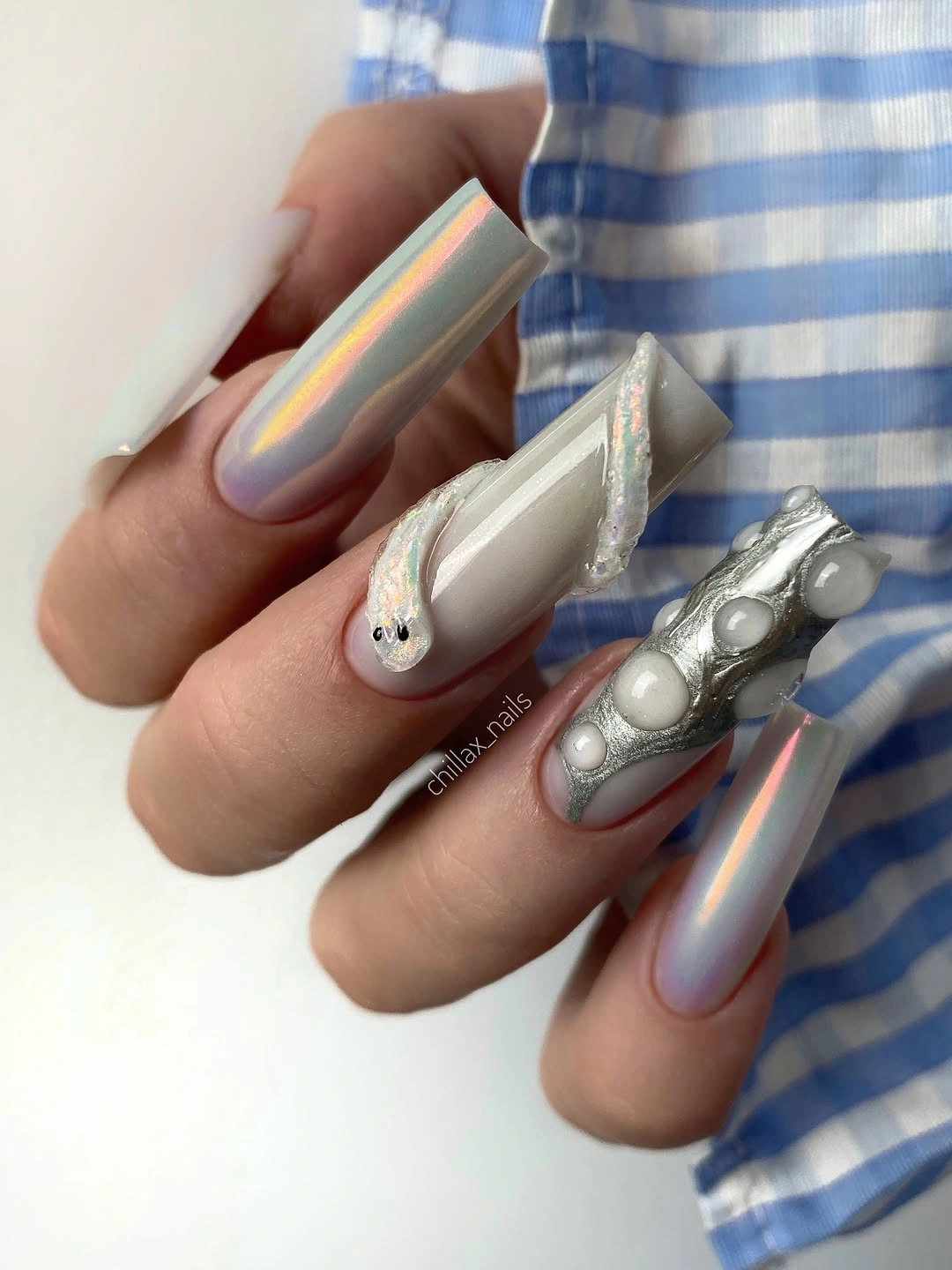 cute early fall nails 2026 Silver Sculptural Nails With Iridescent Details
