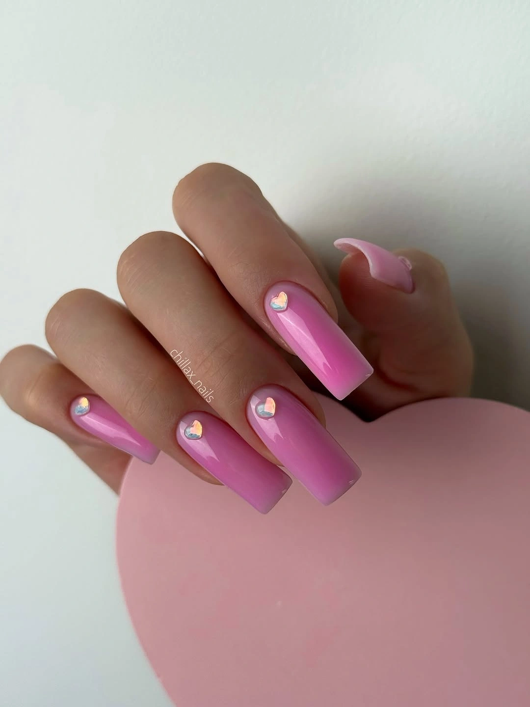 cute early fall nails 2026 Glossy Pink Nails With Tiny Iridescent Hearts