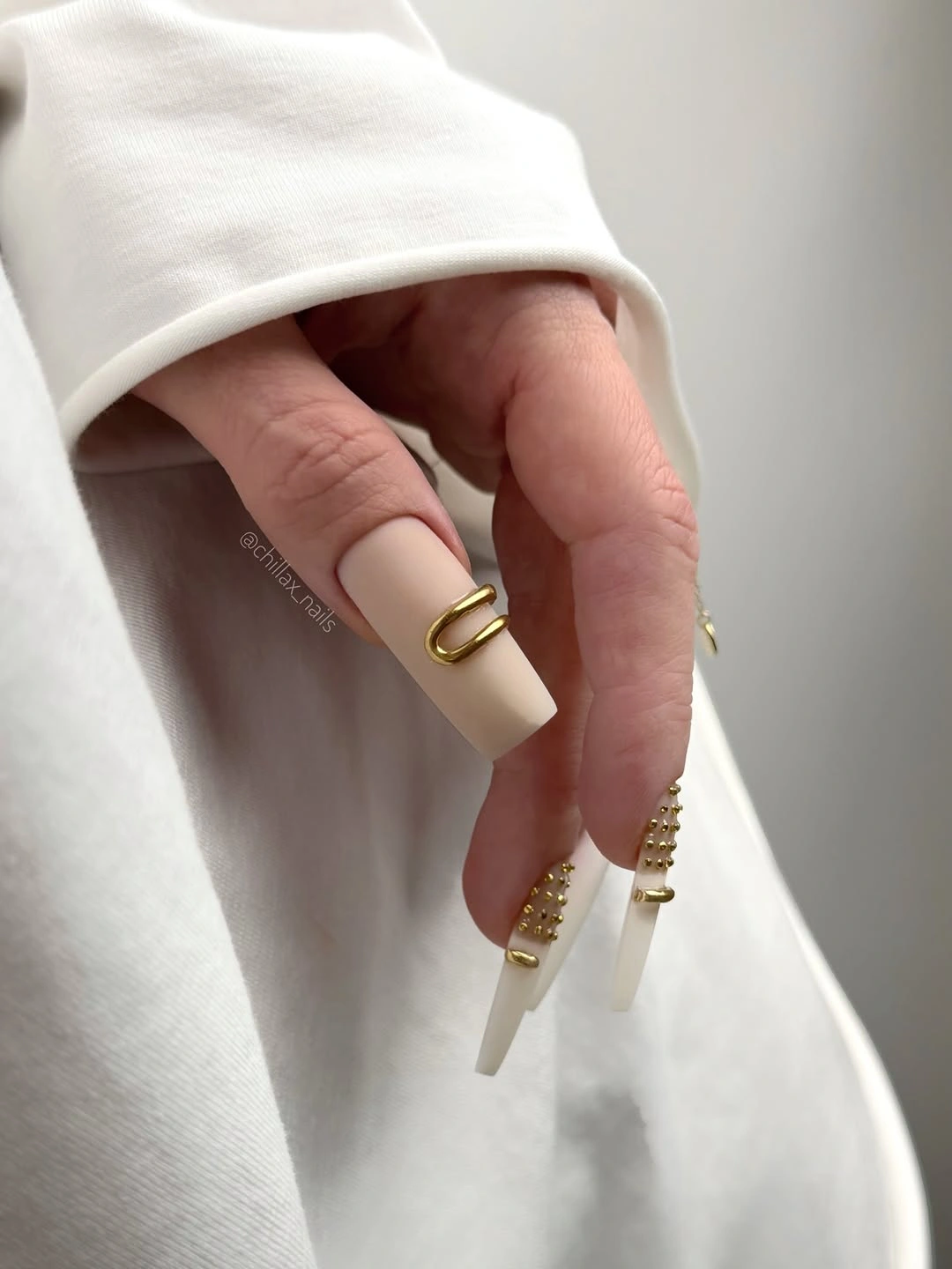 cute early fall nails 2026 Milky Almond Nails With Sculptural Gold Accents