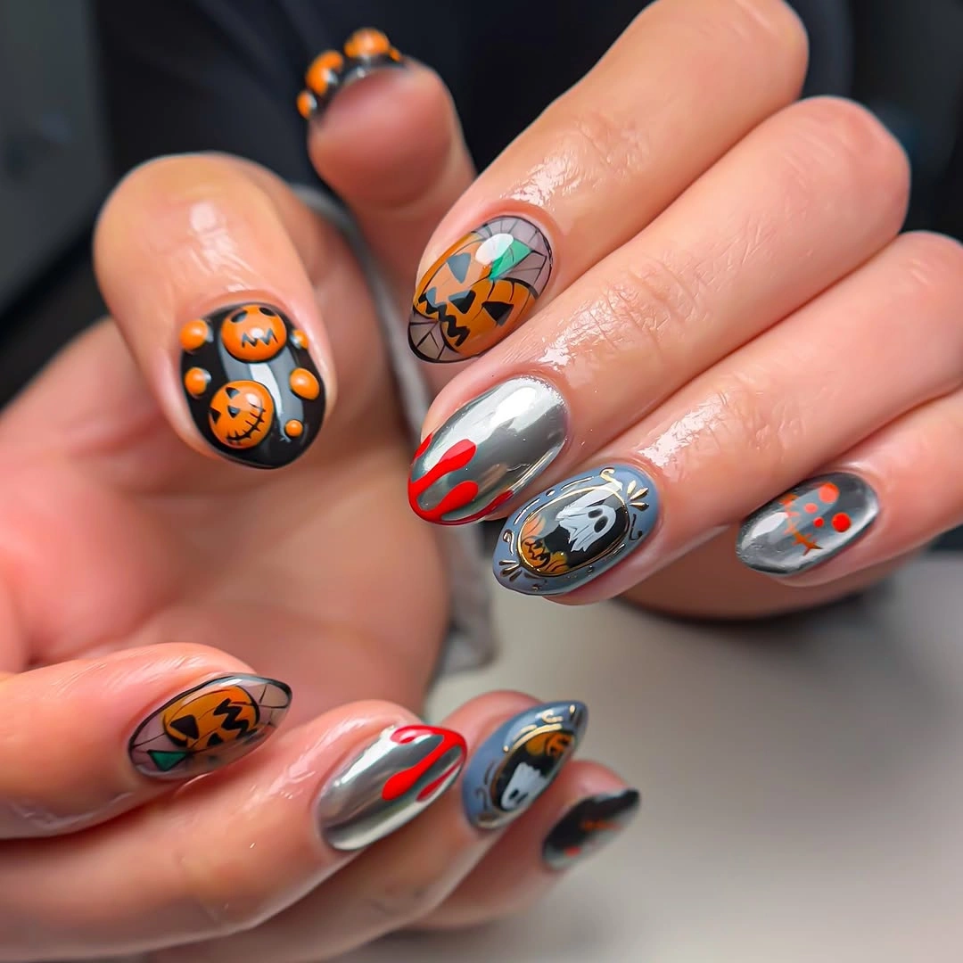 cute halloween nails designs 2026 orange and black Halloween nails with ghosts and pumpkins