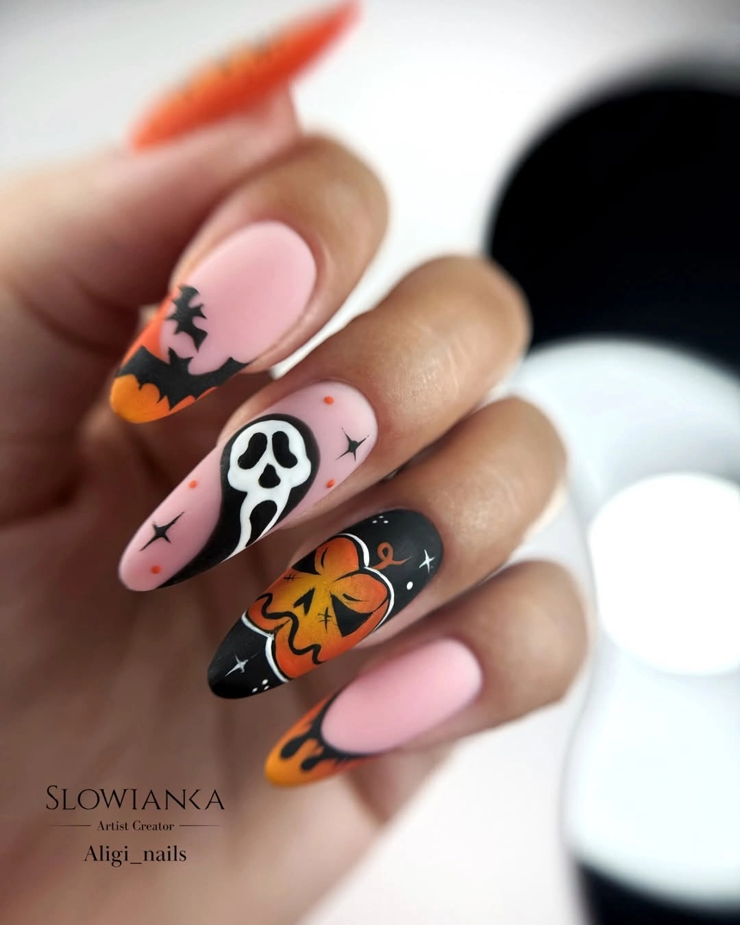 cute halloween nails designs 2026 Pink Ghostface and Pumpkin Almond Nails