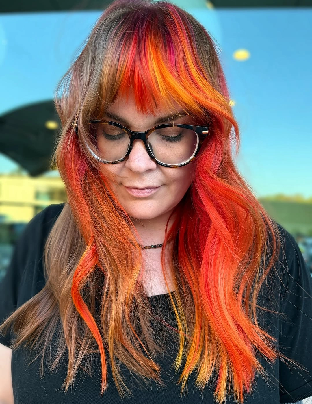 dyed hair ideas Fiery Red and Orange Streaks for an Alt Mood