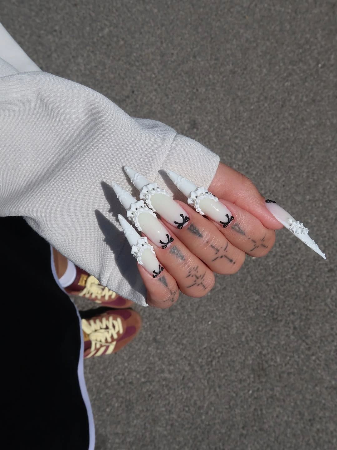 elegant fall long nails 2026 white sculptural nails with black details