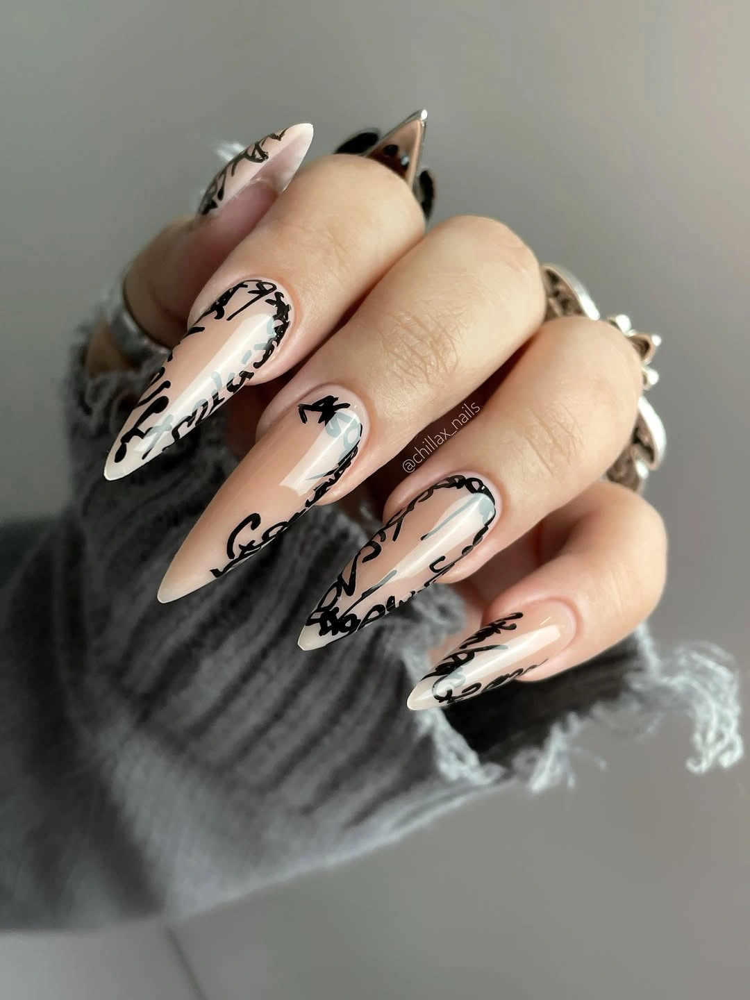 flattering fall nails for olive skin tone 2026 Black Script Stiletto Nails