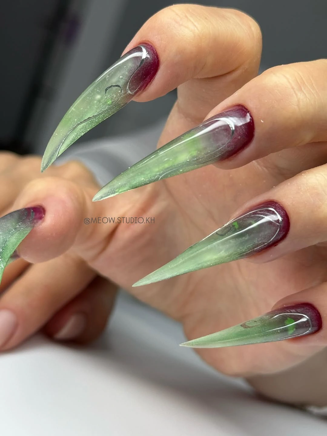 flattering fall nails for olive skin tone 2026 Translucent Sage and Burgundy Stiletto Nails