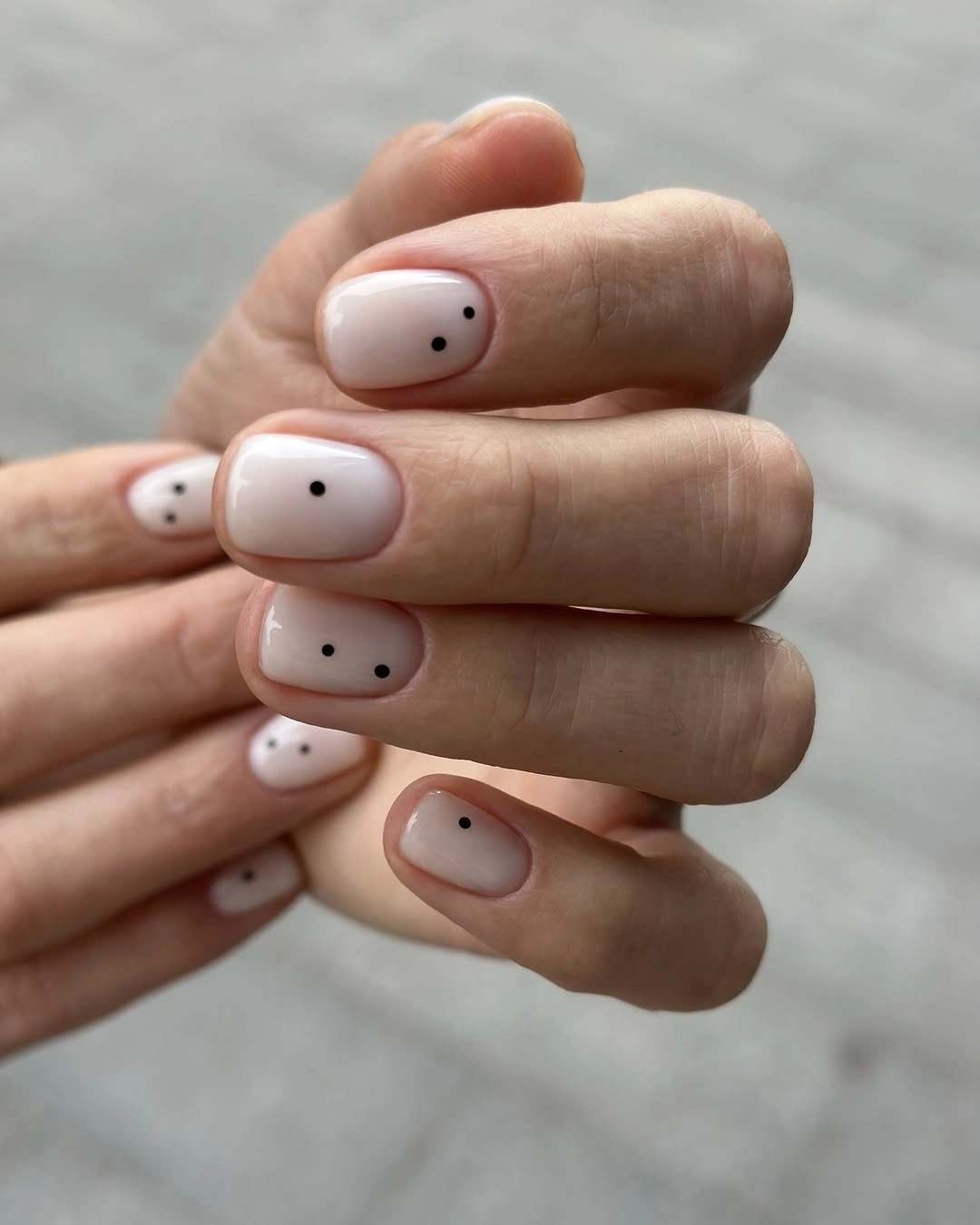 flattering fall nails for olive skin tone 2026 Minimal Black Dots on Blush Nails