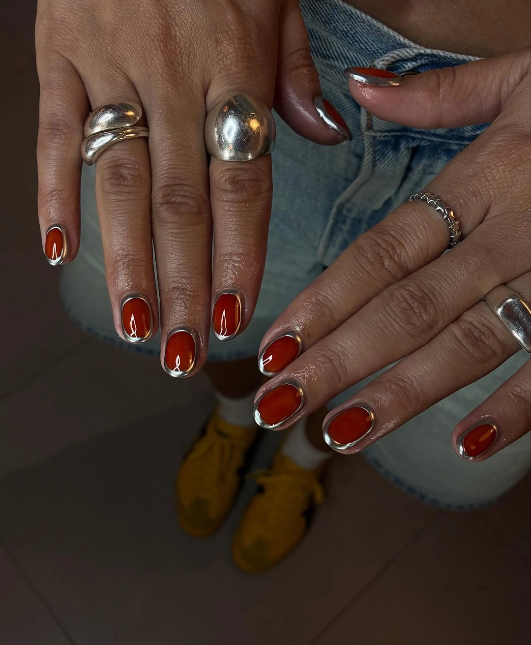 gorgeous fall trendy nails 2026 Burnt Red With Silver Chrome Frames