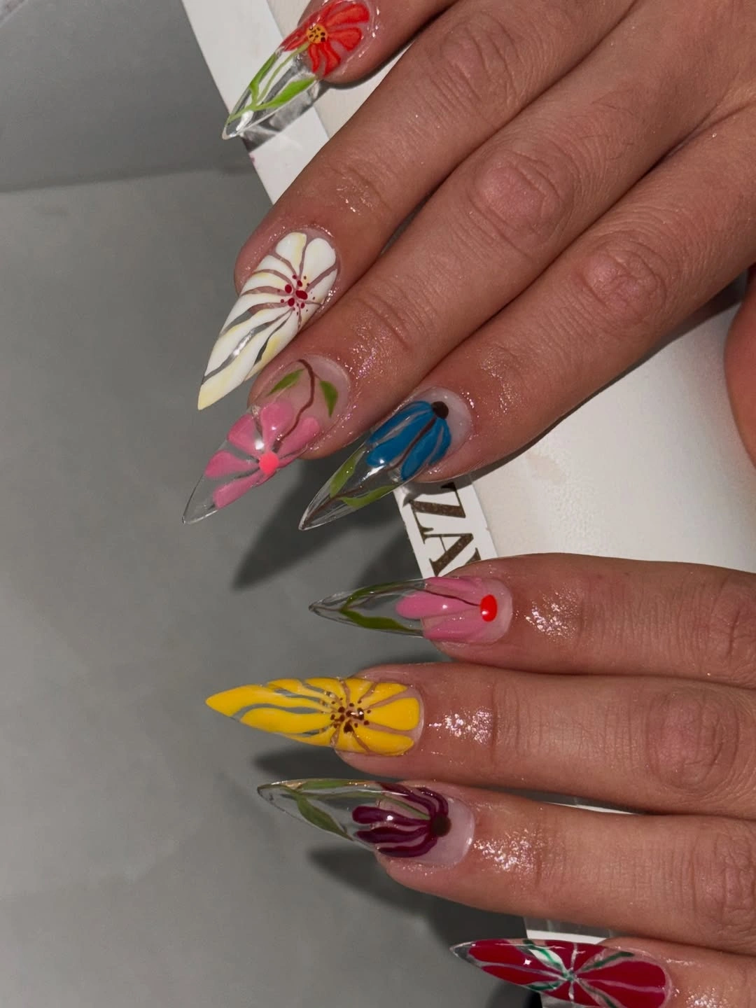 gorgeous fall trendy nails 2026 Colorful Botanical Stiletto Nail Art