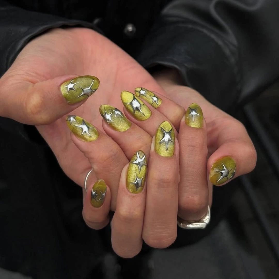 gorgeous fall trendy nails 2026 Olive Green With Metallic Starbursts