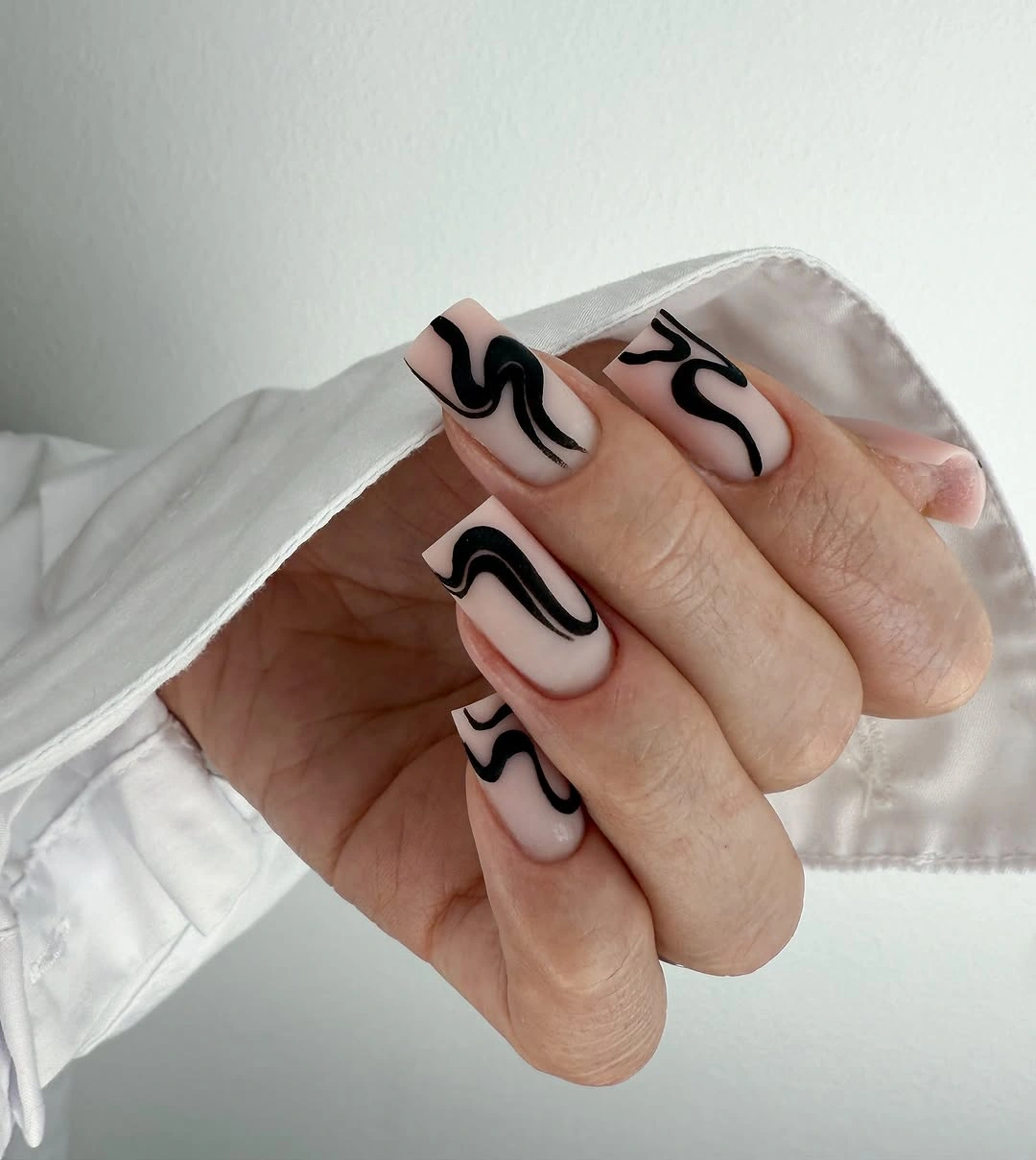 gorgeous fall trendy nails 2026 Black Wavy Lines On A Soft Nude Base