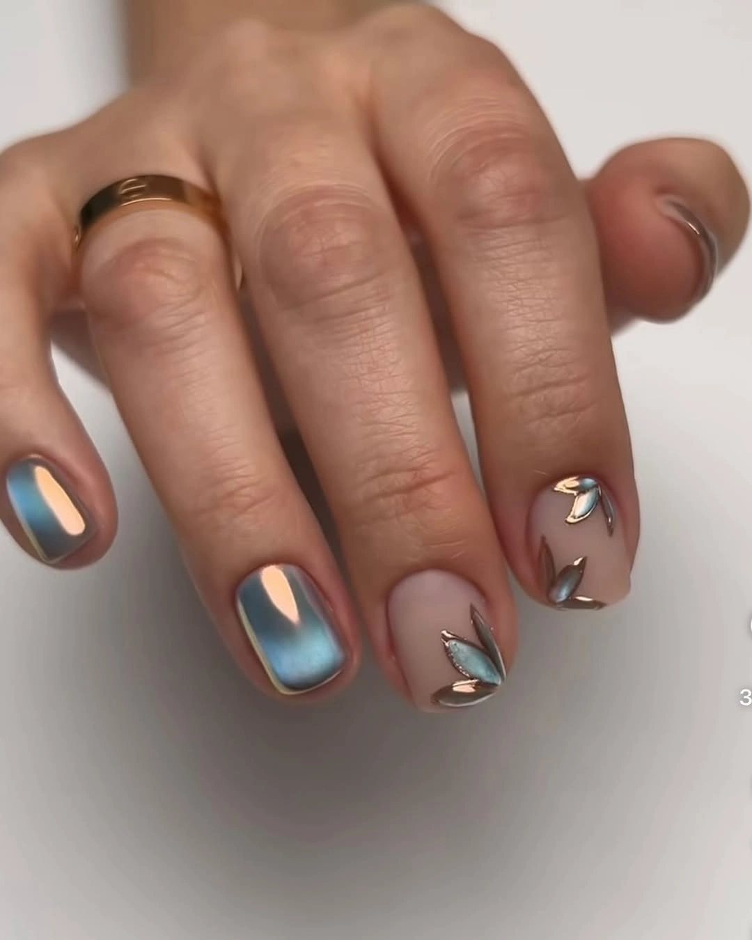 gorgeous october nail colours 2026 Chrome Blue With Sculptural Gold Details