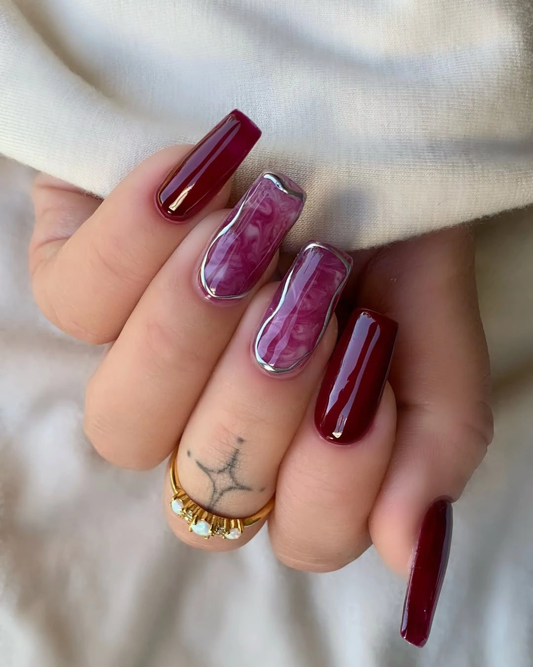 luxurious maroon fall nails 2026 Maroon Marble With Silver Frames