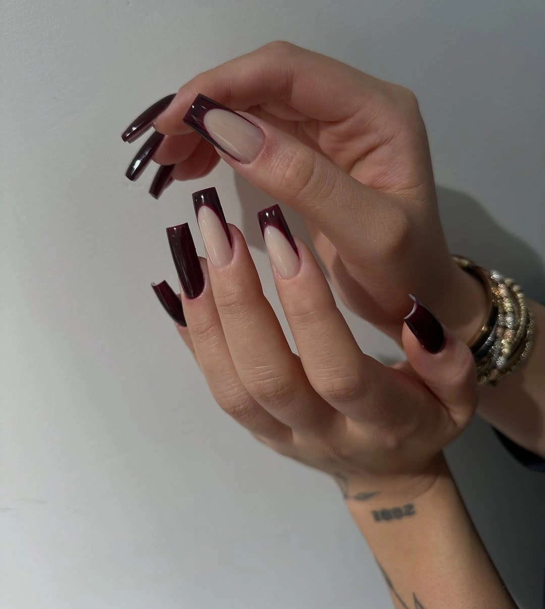 Luxurious maroon fall nails 2026 burgundy French tips on long square nails