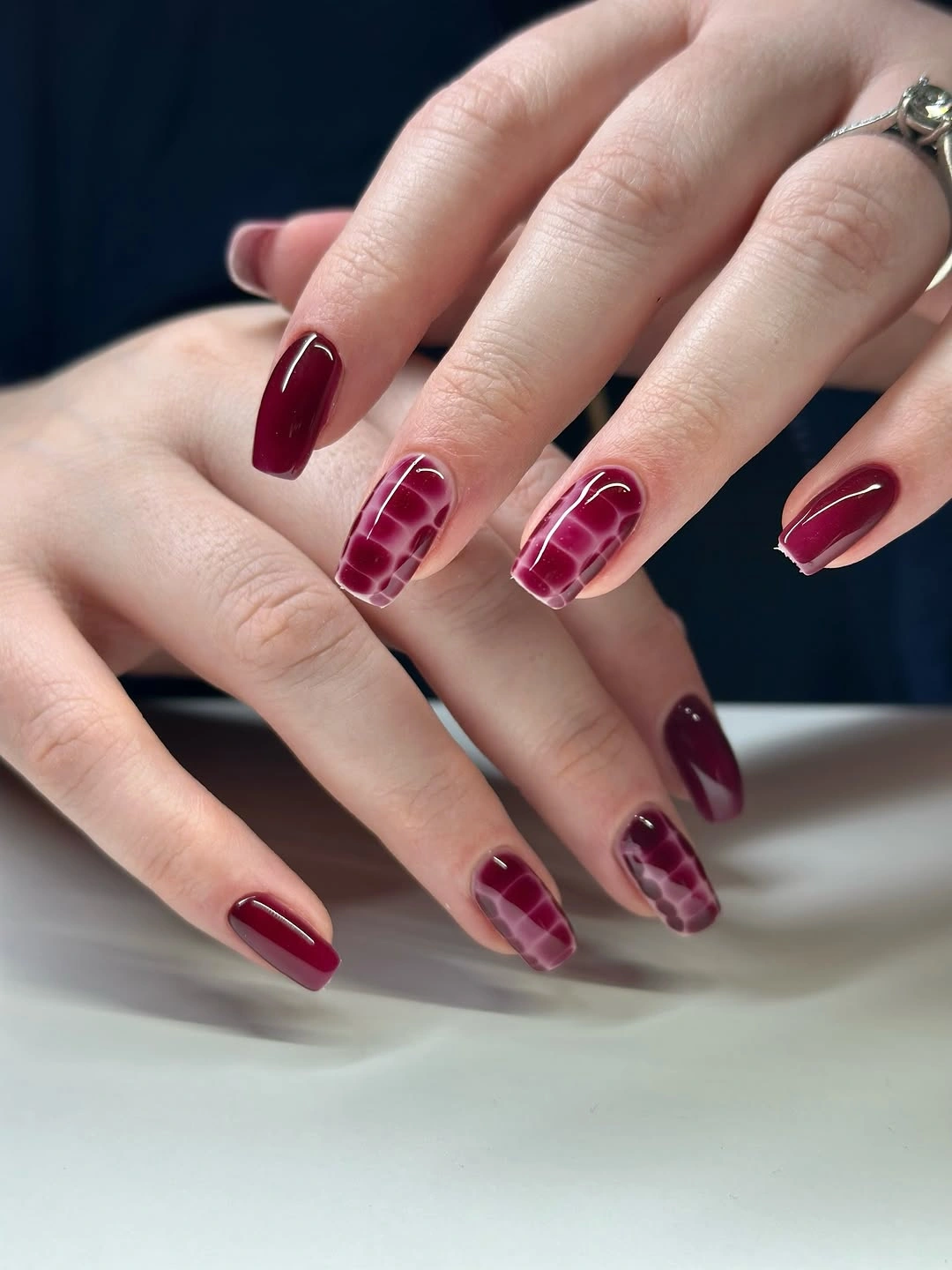 luxurious maroon fall nails 2026 Glossy Maroon With Soft Mosaic Accents