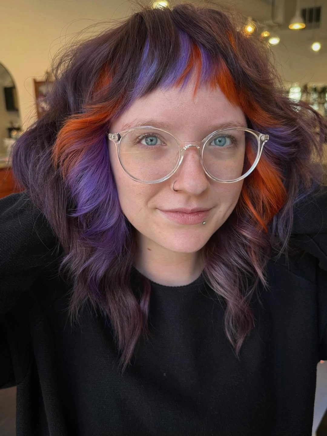modern october haircut ideas 2026 Wavy Purple Shag With Fiery Orange Highlights