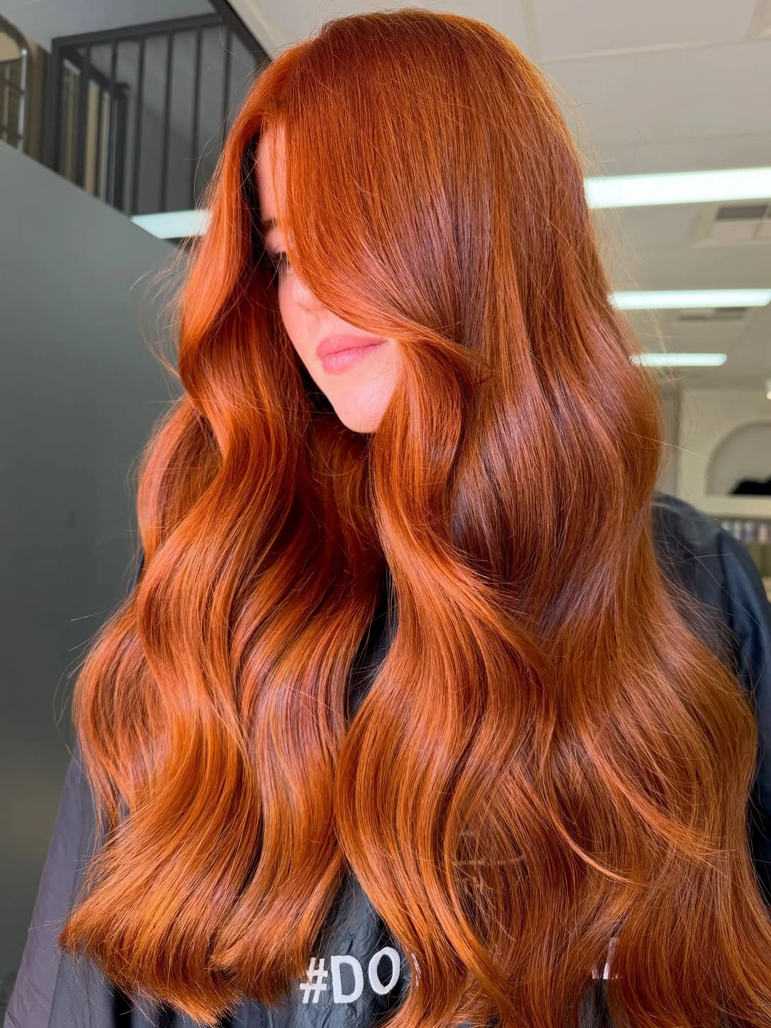 modern october haircut ideas 2026 Rich Copper Waves With Curtain Bangs