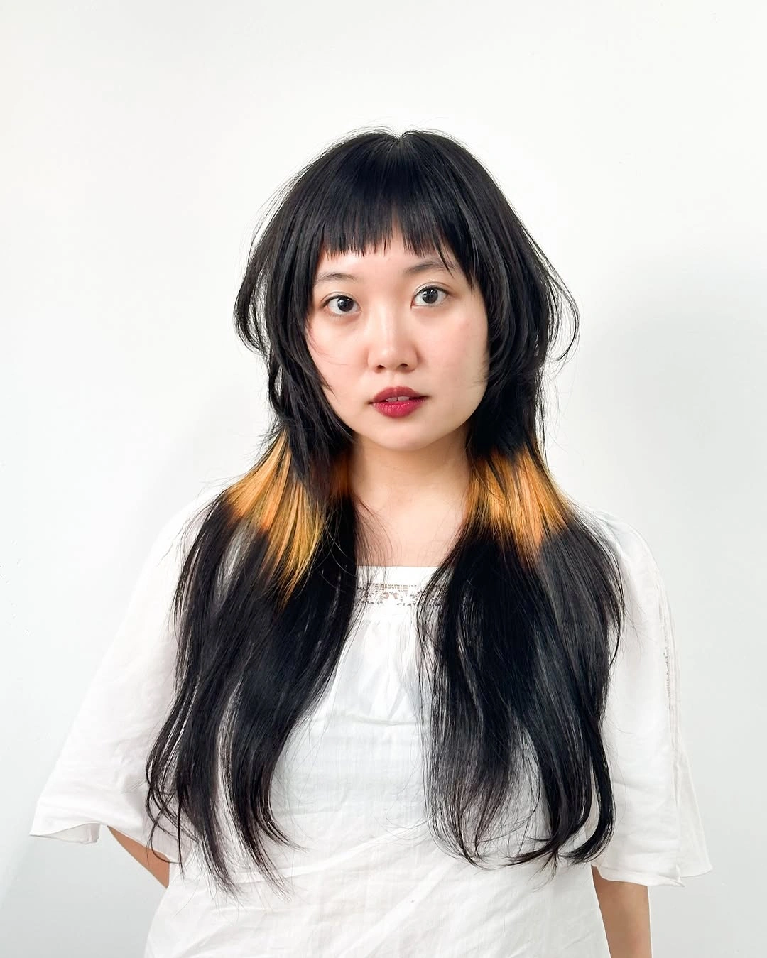 modern october haircut ideas 2026 Black Long Layers With Hidden Golden Pieces