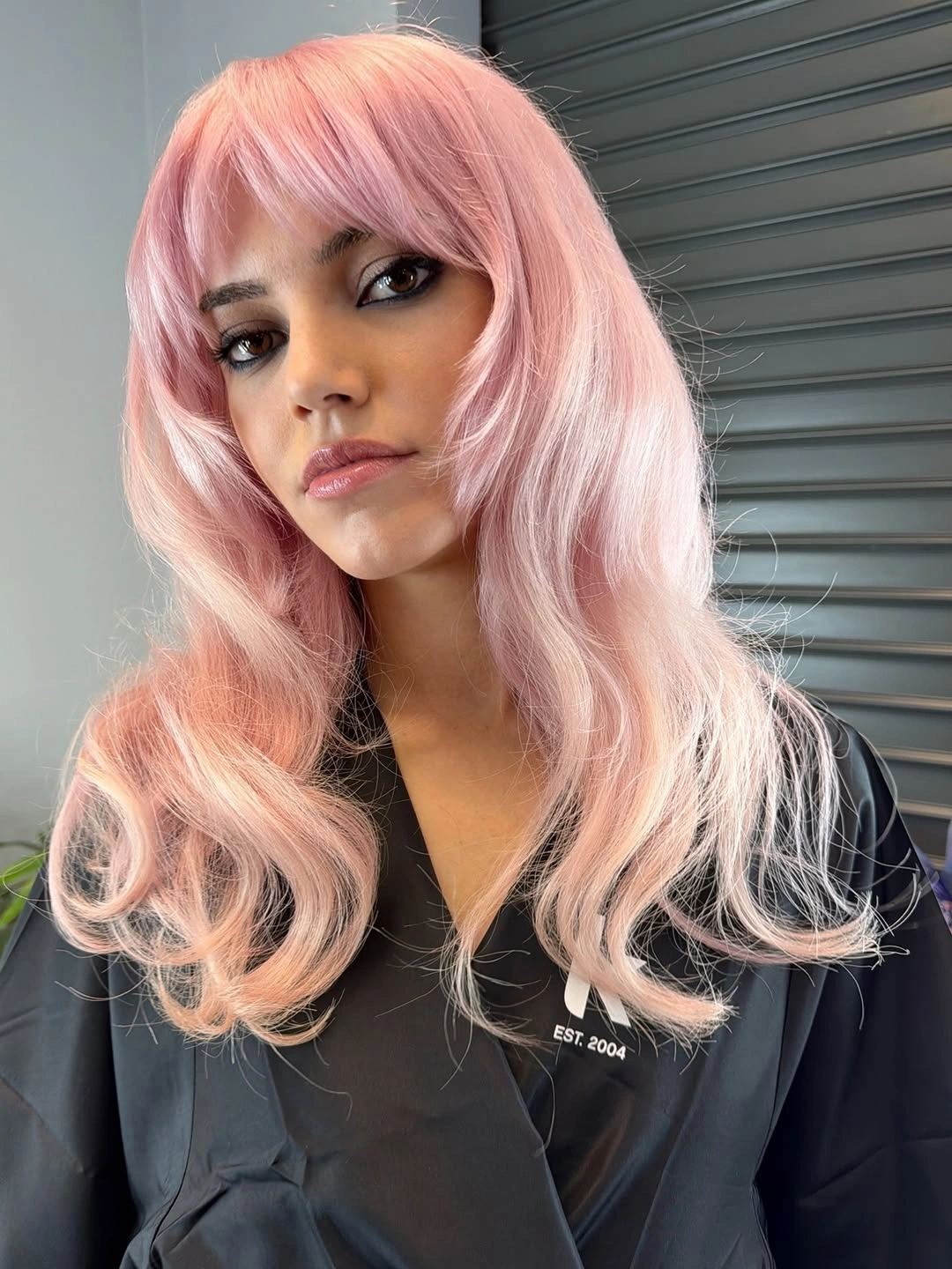 modern october haircut ideas 2026 Pastel Pink Waves With Romantic Face-Framing Layers