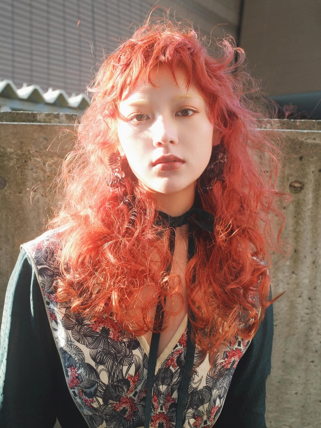 modern october haircut ideas 2026 Voluminous Copper Curls With Playful Bangs
