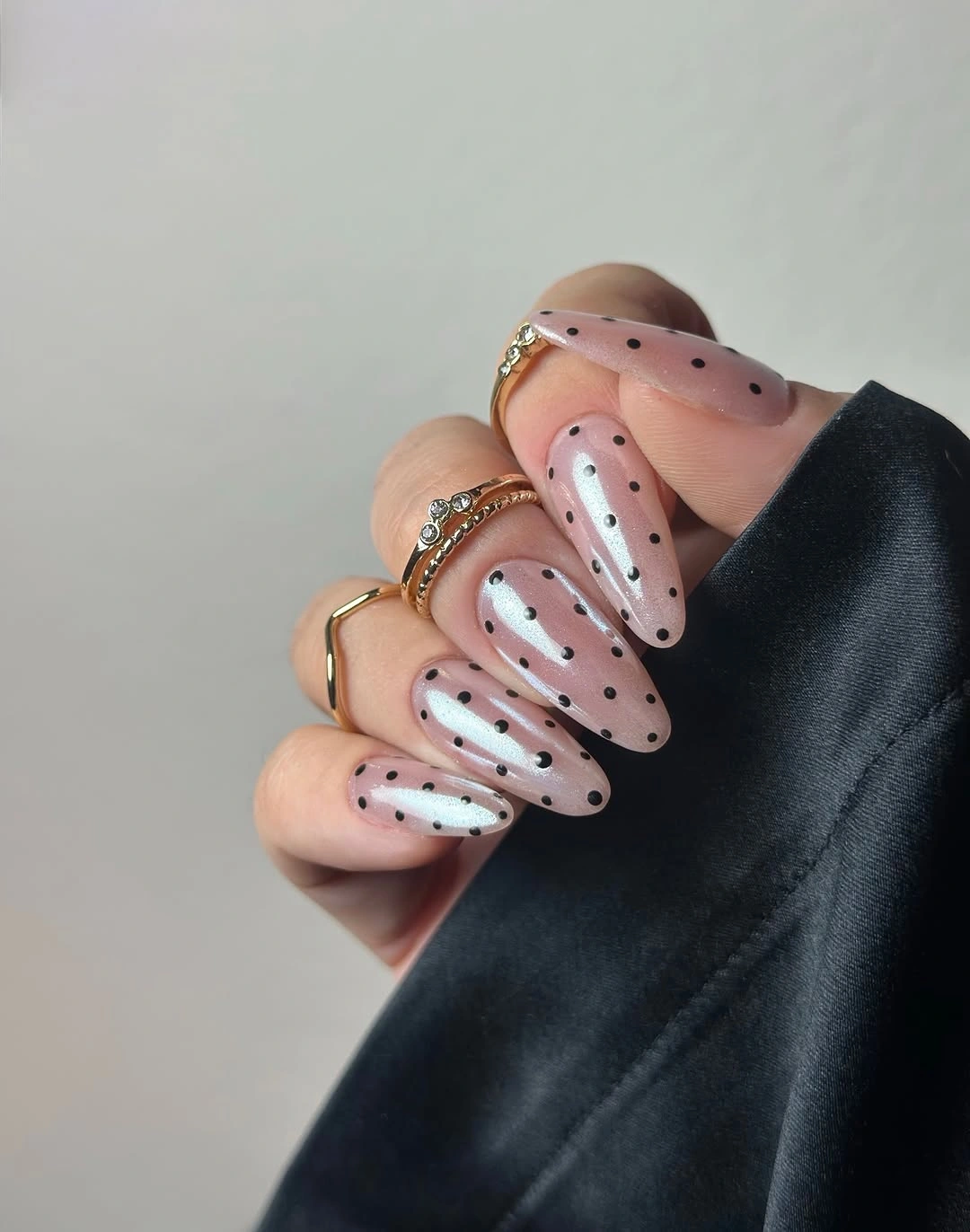 playful polka dot fall nails 2026 Pink Chrome Almond Nails With Tiny Black Polka Dots