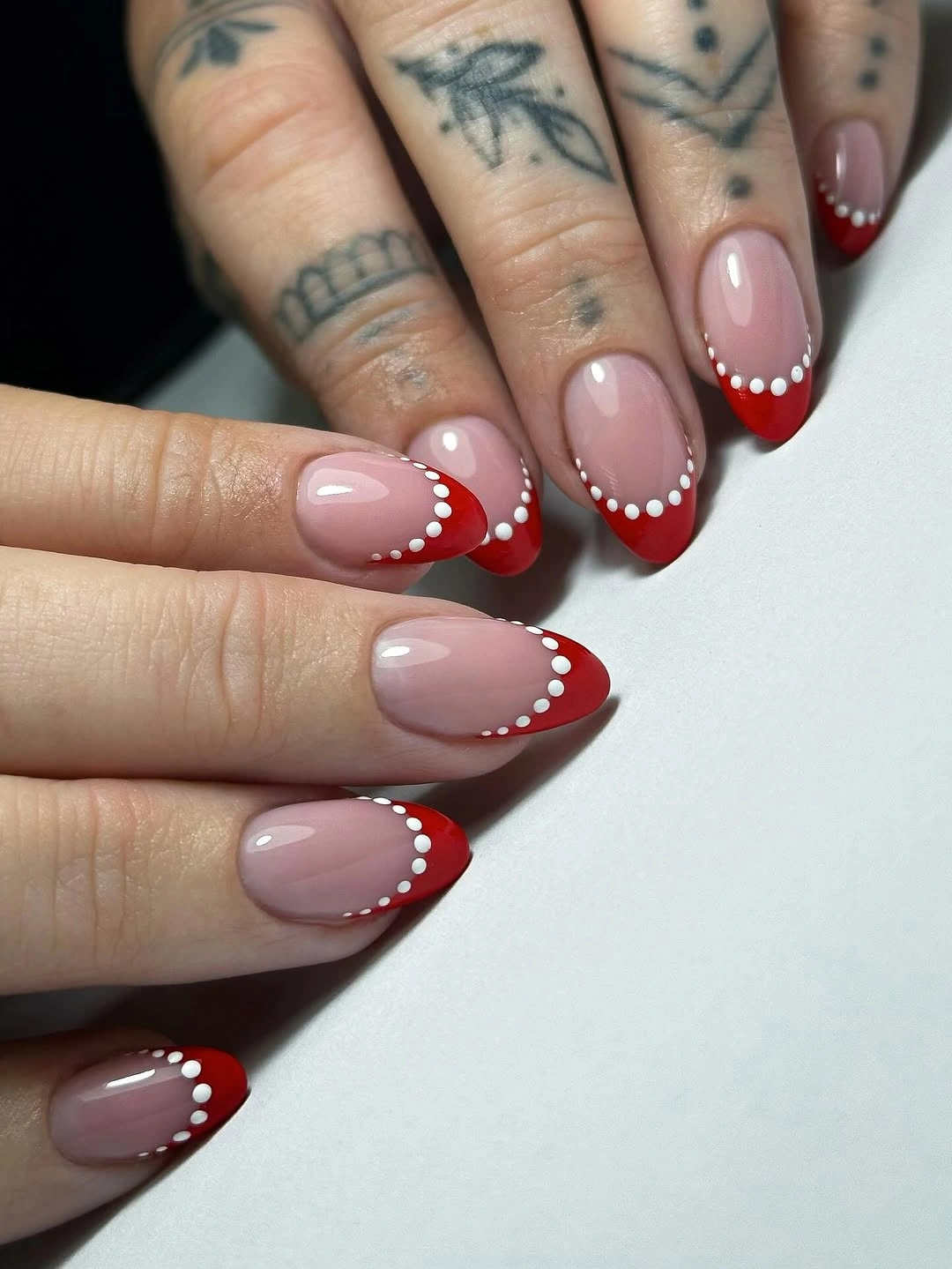 playful polka dot fall nails 2026 Red French Tips With a White Polka Dot Border