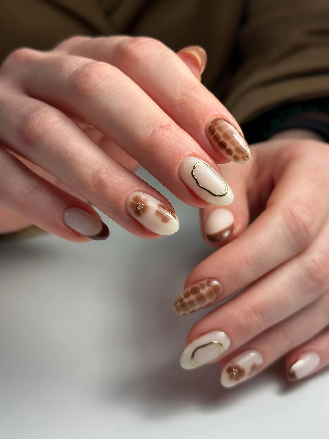 rich brown fall nails 2026 Warm Latte Nail Art With Delicate Details