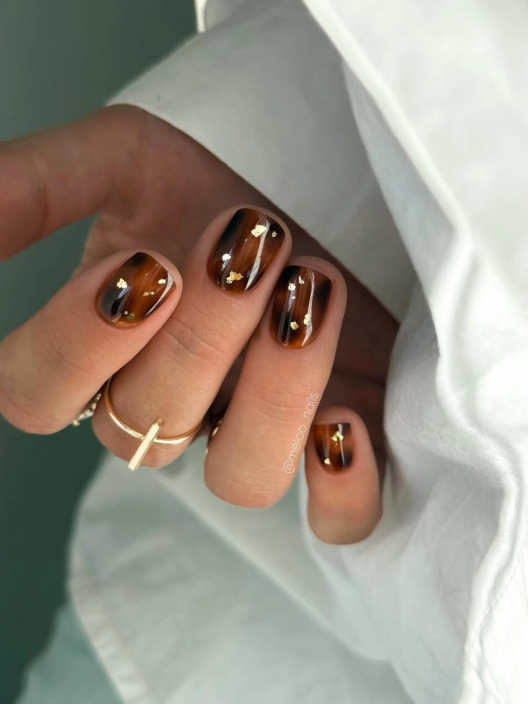 rich brown fall nails 2026 Amber Brown Glass Nails With Gold Foil