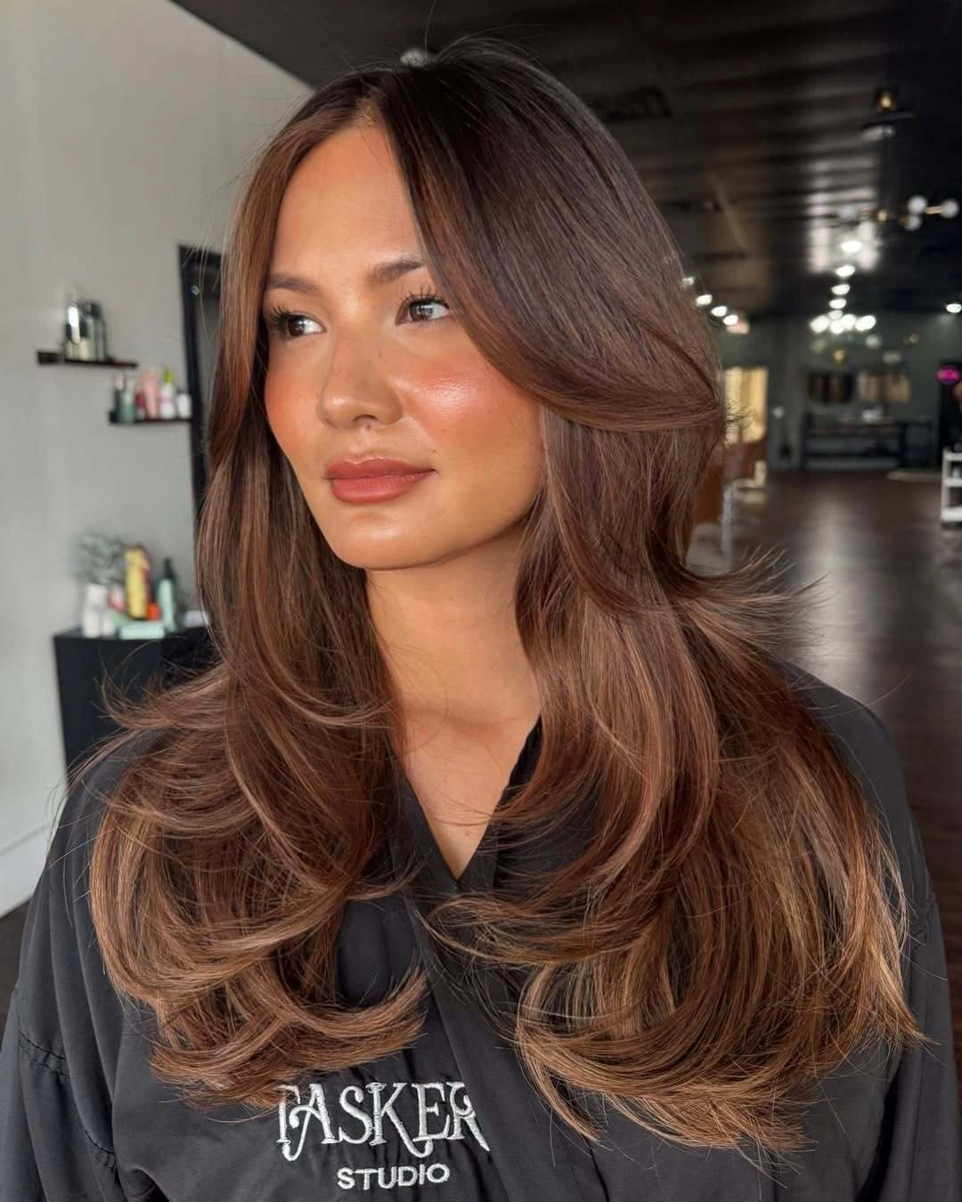 rich fall brown hair colour ideas 2026 Feathered Chocolate Blowout With Luxurious Volume