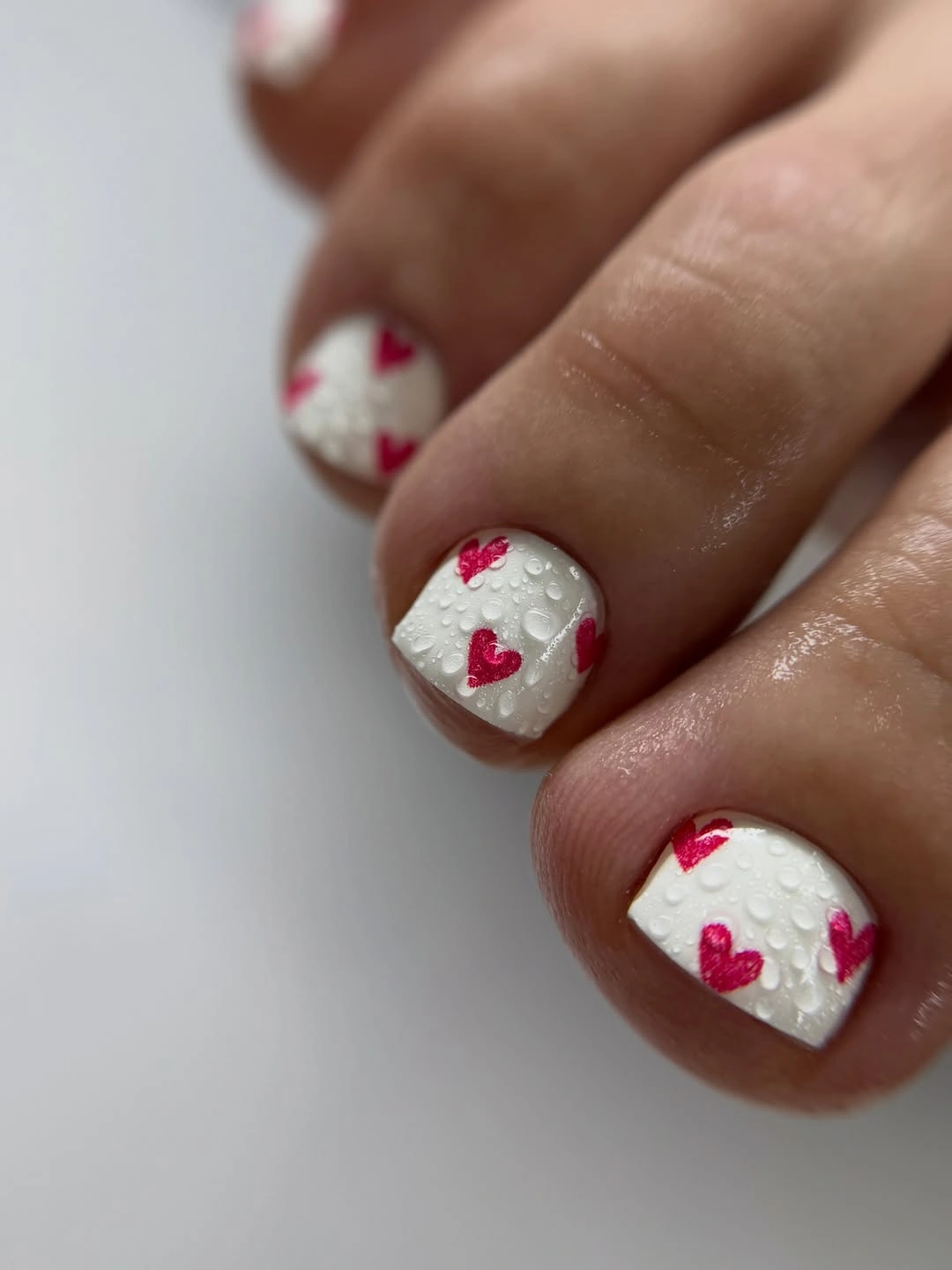 rich fall toe nails colors 2026 Milky White Toes with Cranberry Hearts