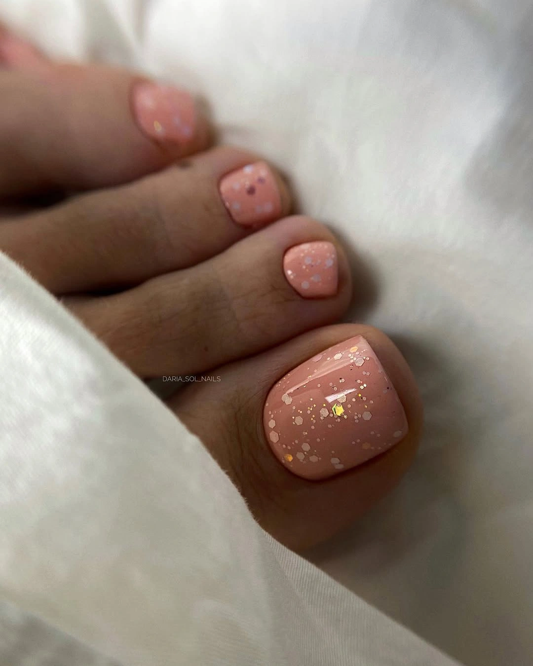 rich fall toe nails colors 2026 Blush Pink with Delicate Glitter
