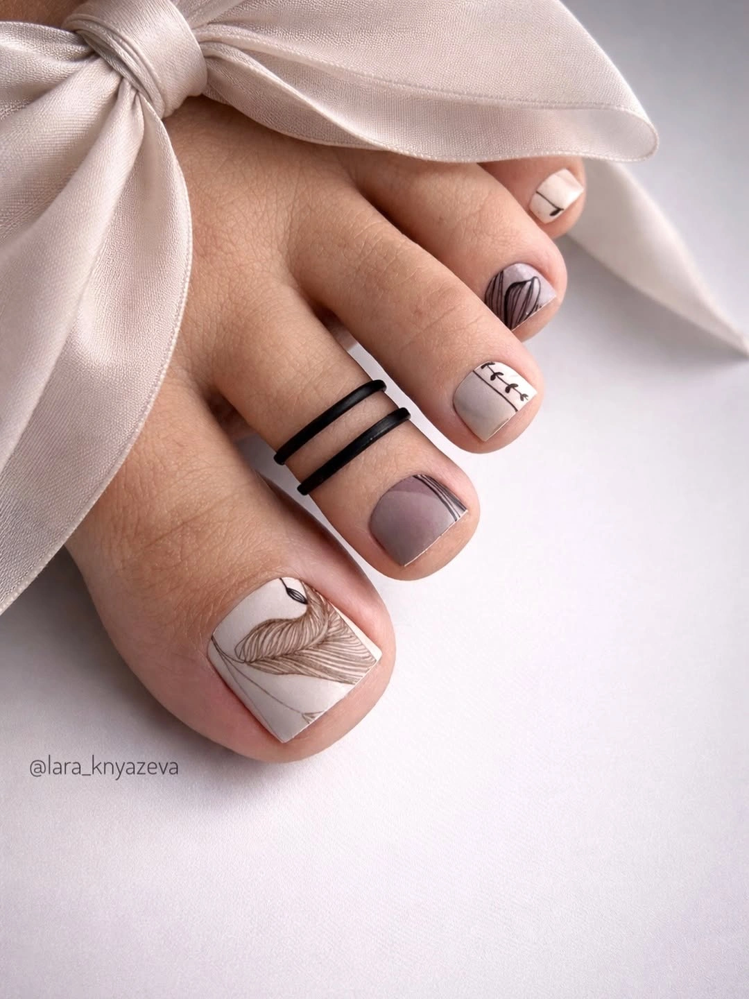 rich fall toe nails colors 2026 Soft Taupe with Botanical Line Art