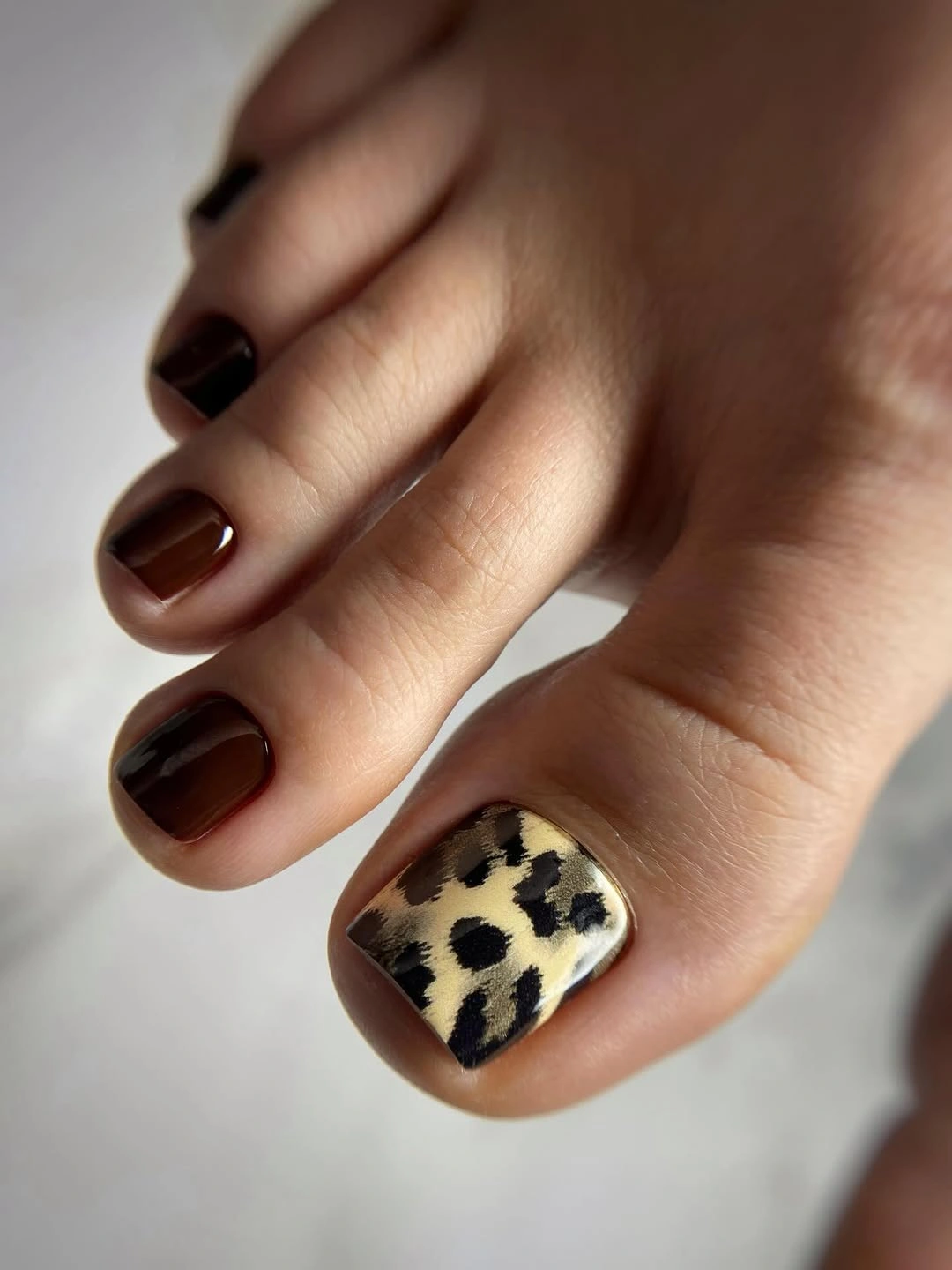rich fall toe nails colors 2026 Espresso Brown with a Leopard Accent