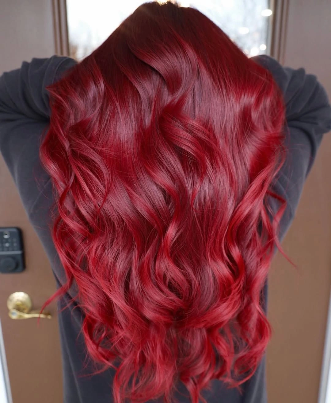 rich october hair colour ideas 2026 Glossy Cherry Red Waves