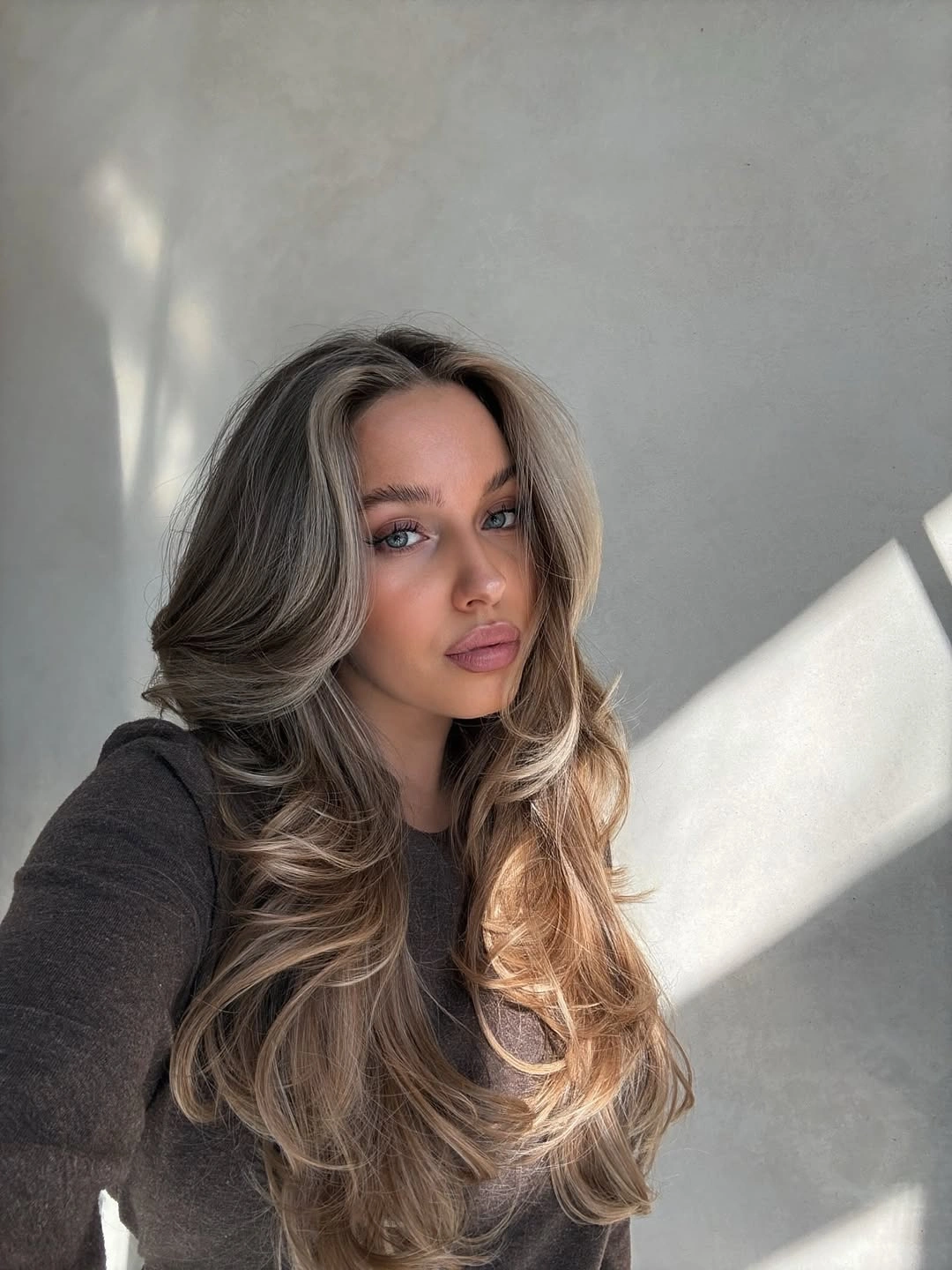 rich october hair colour ideas 2026 Smoky Mushroom Brown With Feathered Layers