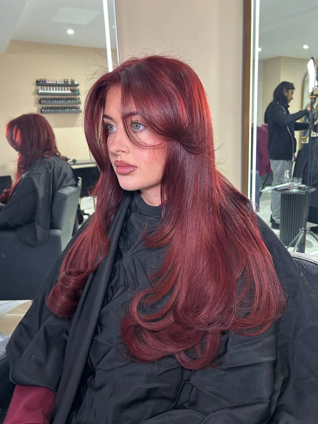 rich october hair colour ideas 2026 Glossy Burgundy With Soft Curtain Bangs