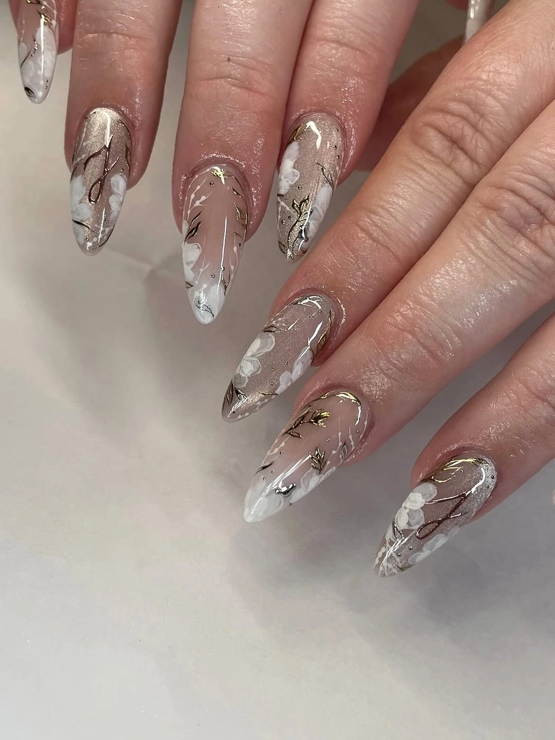 romantic fall wedding nails 2026 Neutral Florals With Golden Botanical Details