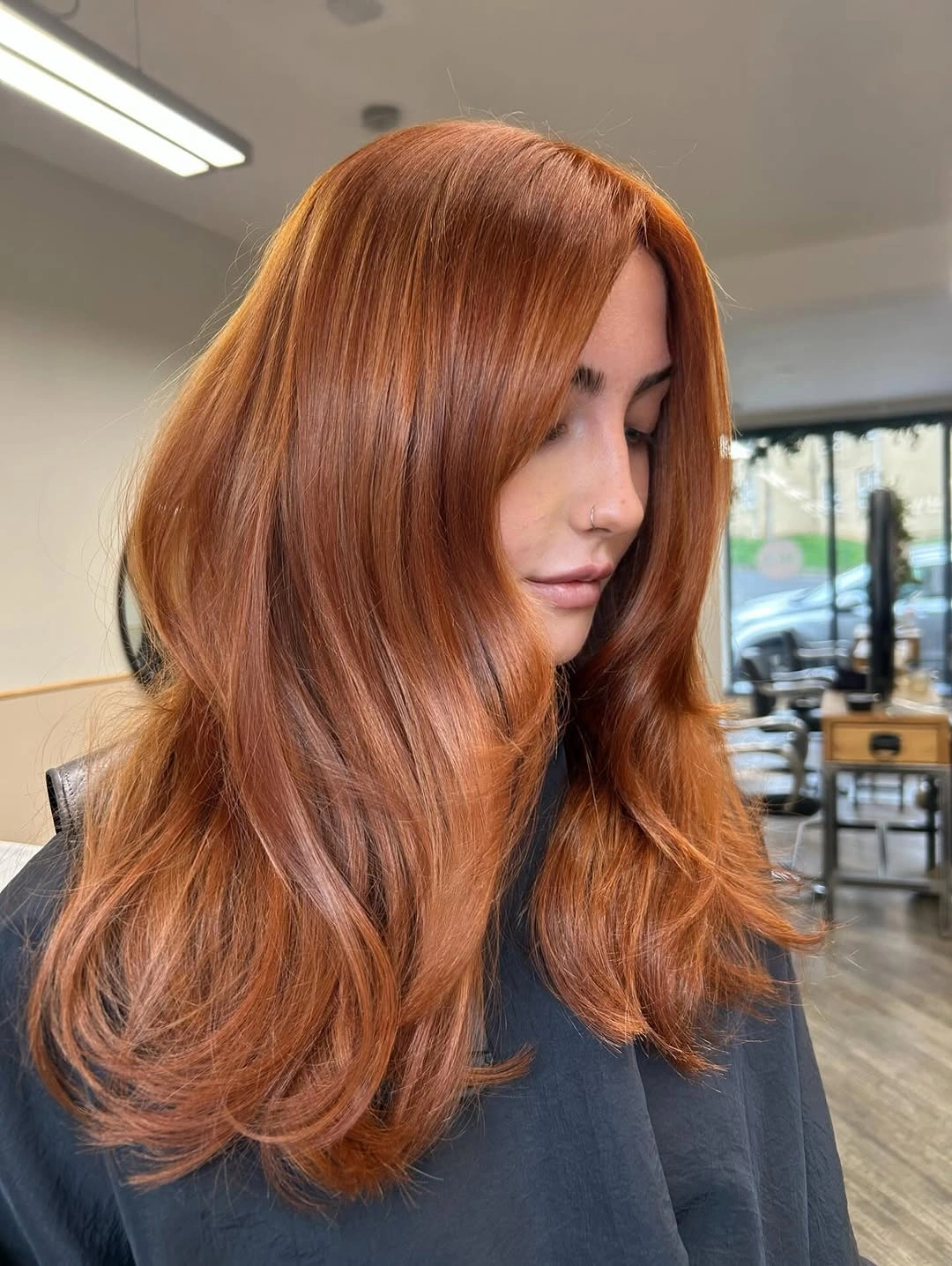 stunning september hair colour trends 2026 Glossy Burnished Copper for Long Layered Hair