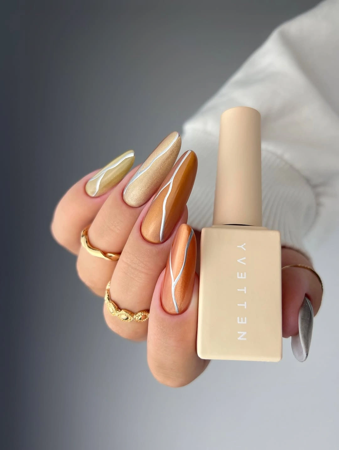 stylish fall dip nails 2026 Caramel Metallic Swirl Nails